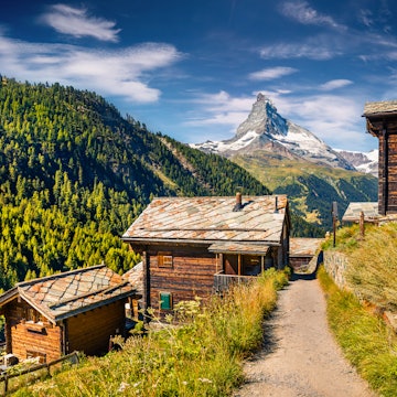 Sunny summer morning in Zermatt village with Matterhorn (Monte Cervino, Mont Cervin) peak on backgroud. Beautiful outdoor scene in  Swiss Alps, Valais canton, Switzerland, Europe.